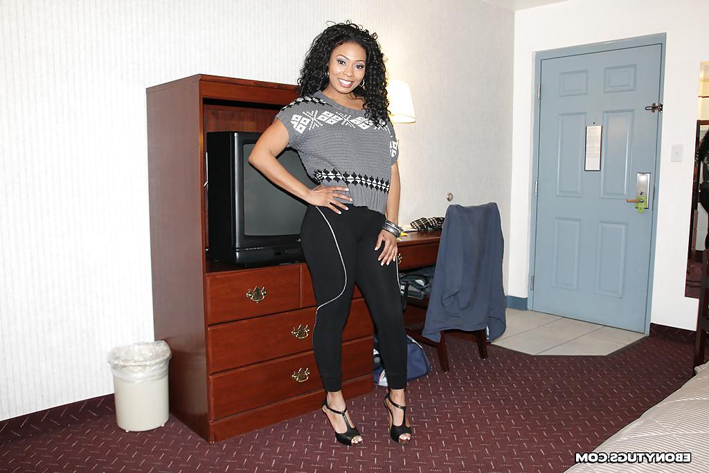 16P Curly-haired ebony chick with ample booty slowly getting rid of her clothes