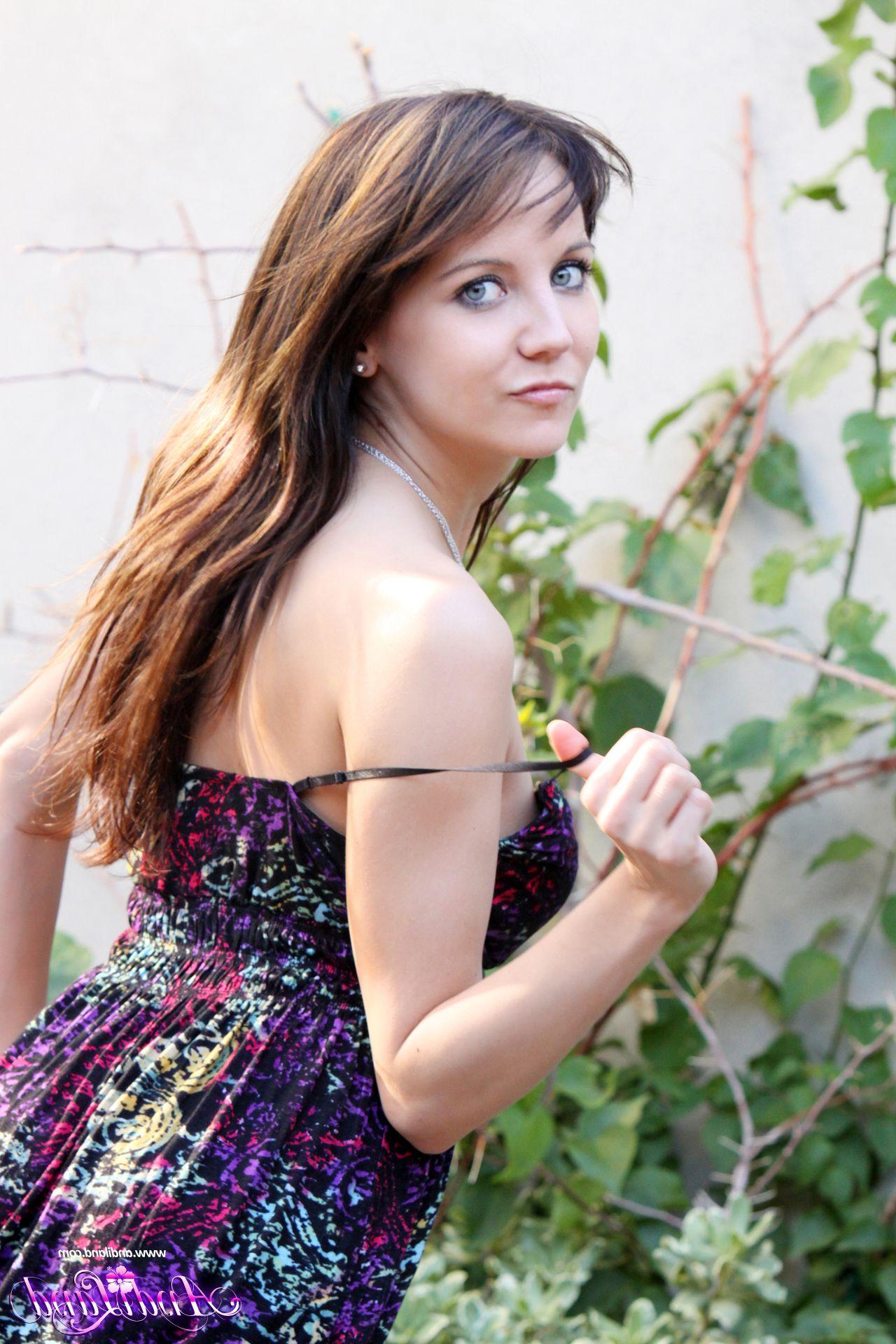 15P Pictures of teen Andi Land stripping for you in the back yard