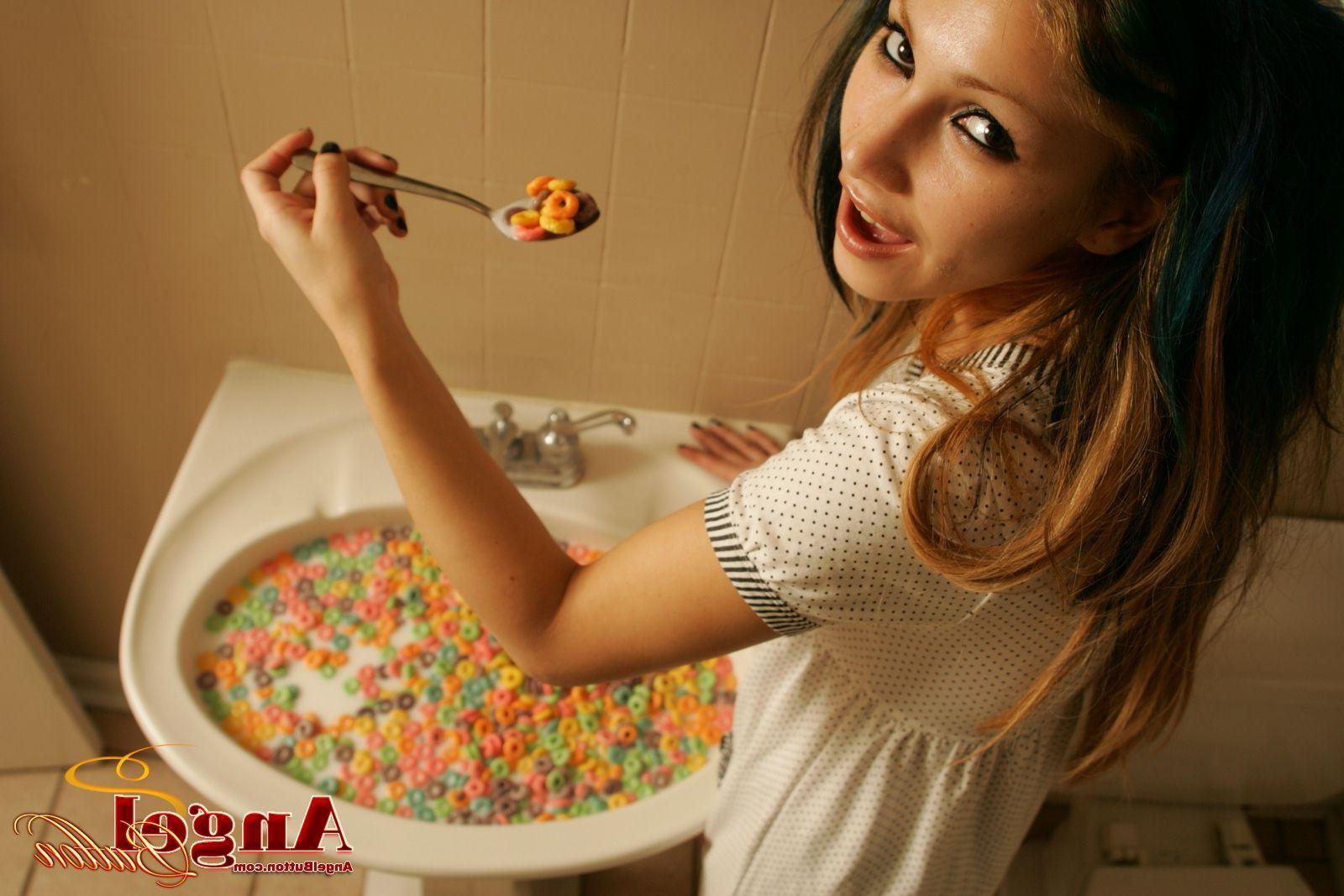 20P Pictures of Angel Button eating cereal out of the sink