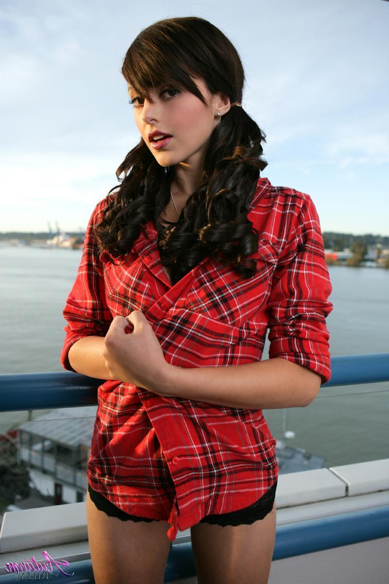14P Pretty girl Autumn Riley strips out of her flannel shirt on the balcony