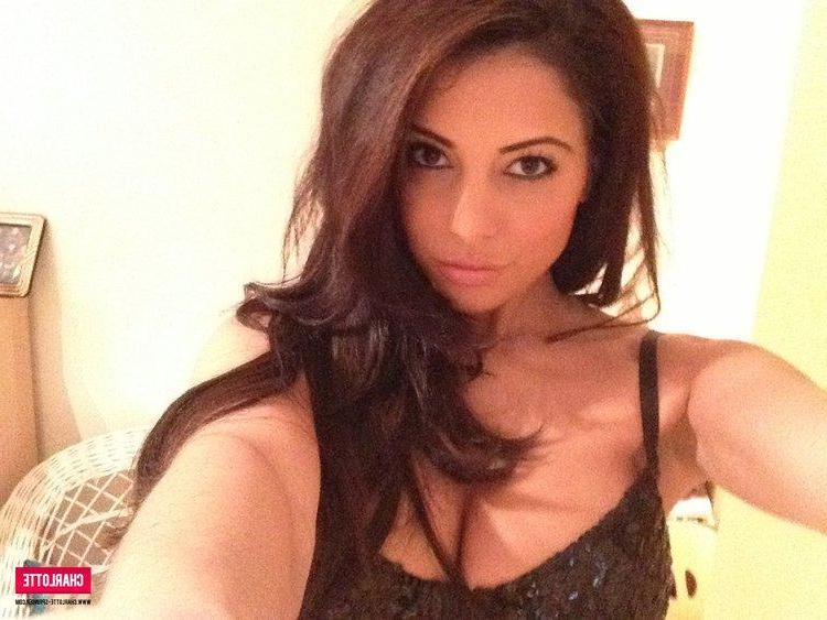 12P Busty brunette hottie Charlotte strips from her black top to expose her big boobs