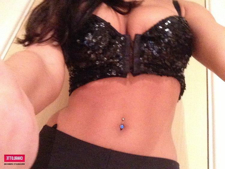 12P Busty brunette hottie Charlotte strips from her black top to expose her big boobs