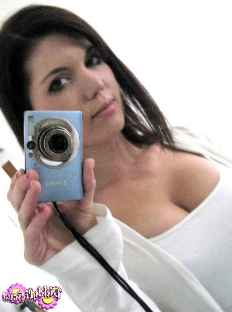 12P Diddy takes selfshot mirror pictures of her juicy tits in a tight bra