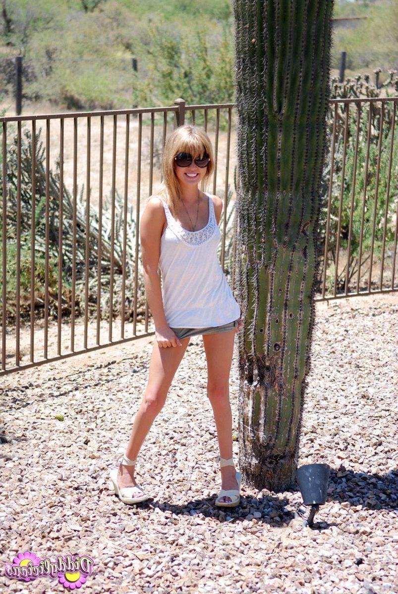 20P Pictures of Diddylicious stripping to her underwear outside
