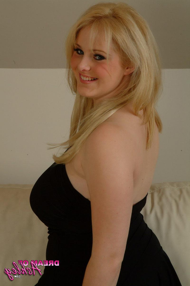 16P Busty teen Ashley pulls down her black dress to release her big boobs