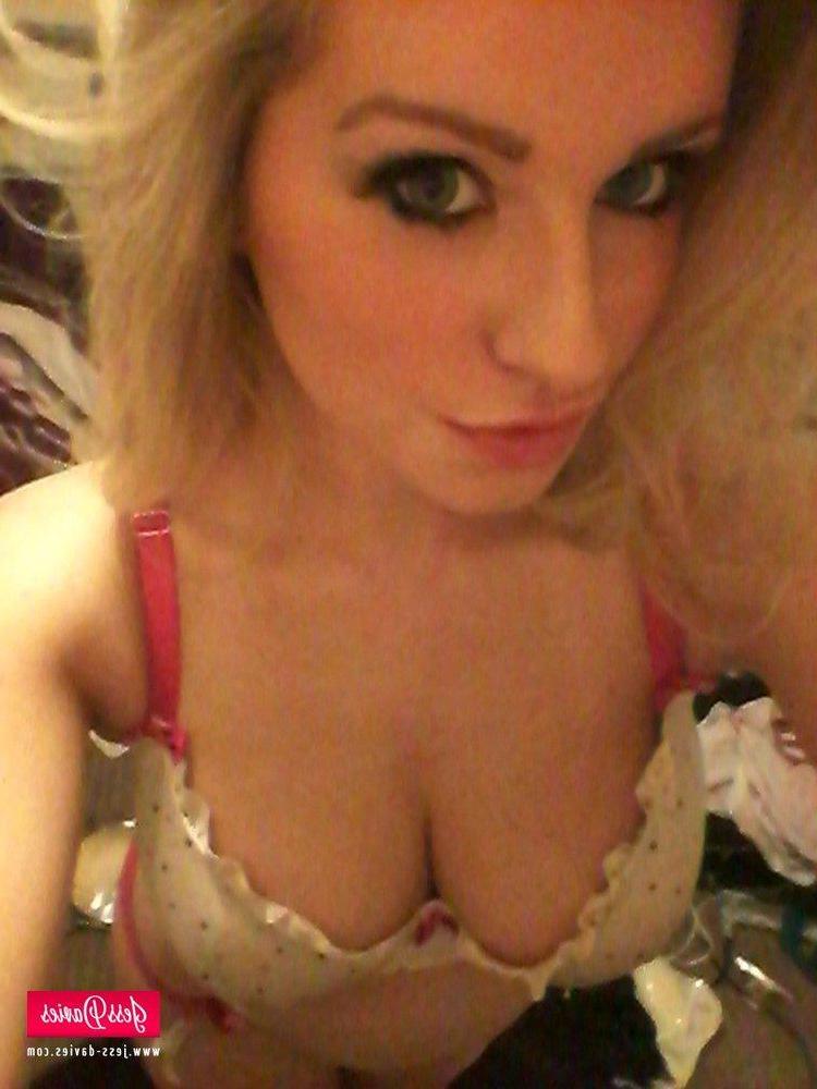 12P Jess Davies strips from her spotted white lingerie to reveal her big round boobs