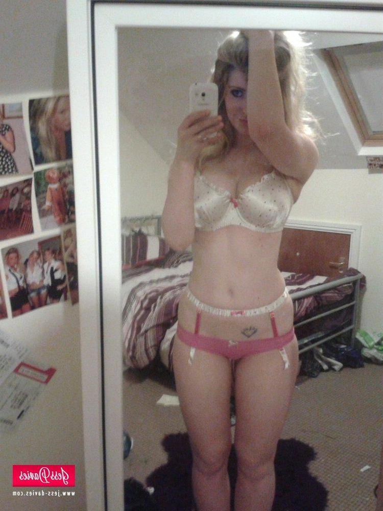 12P Jess Davies strips from her spotted white lingerie to reveal her big round boobs