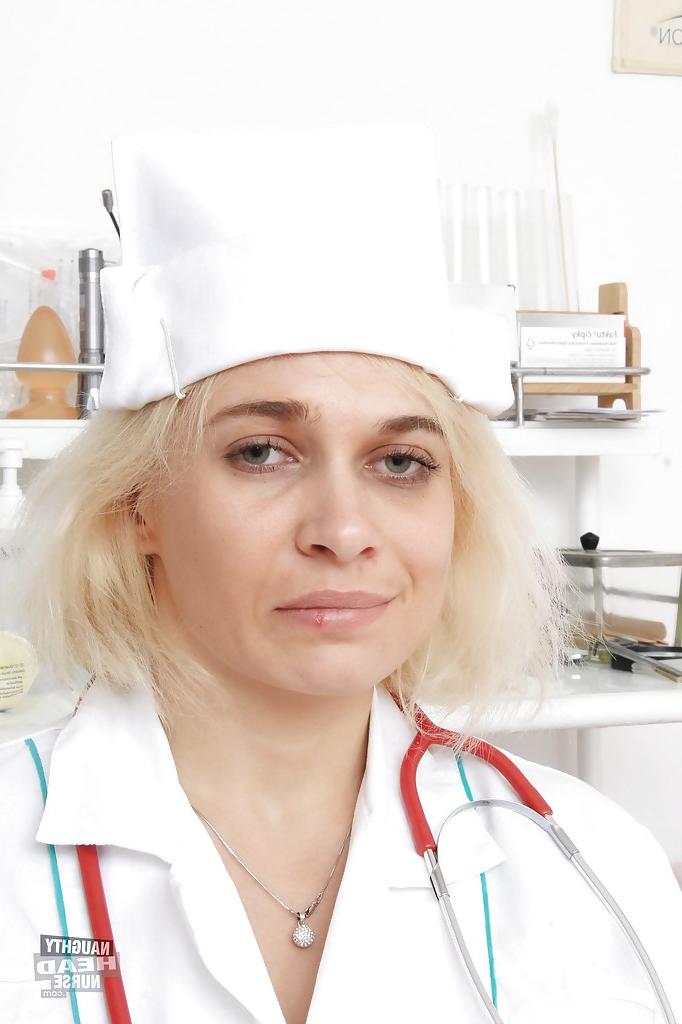 16P Chubby older nurse Sandy stripping off uniform before masturbation session