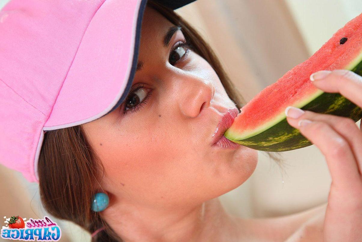 15P Pictures of teen cutie Little Caprice eating something sweet