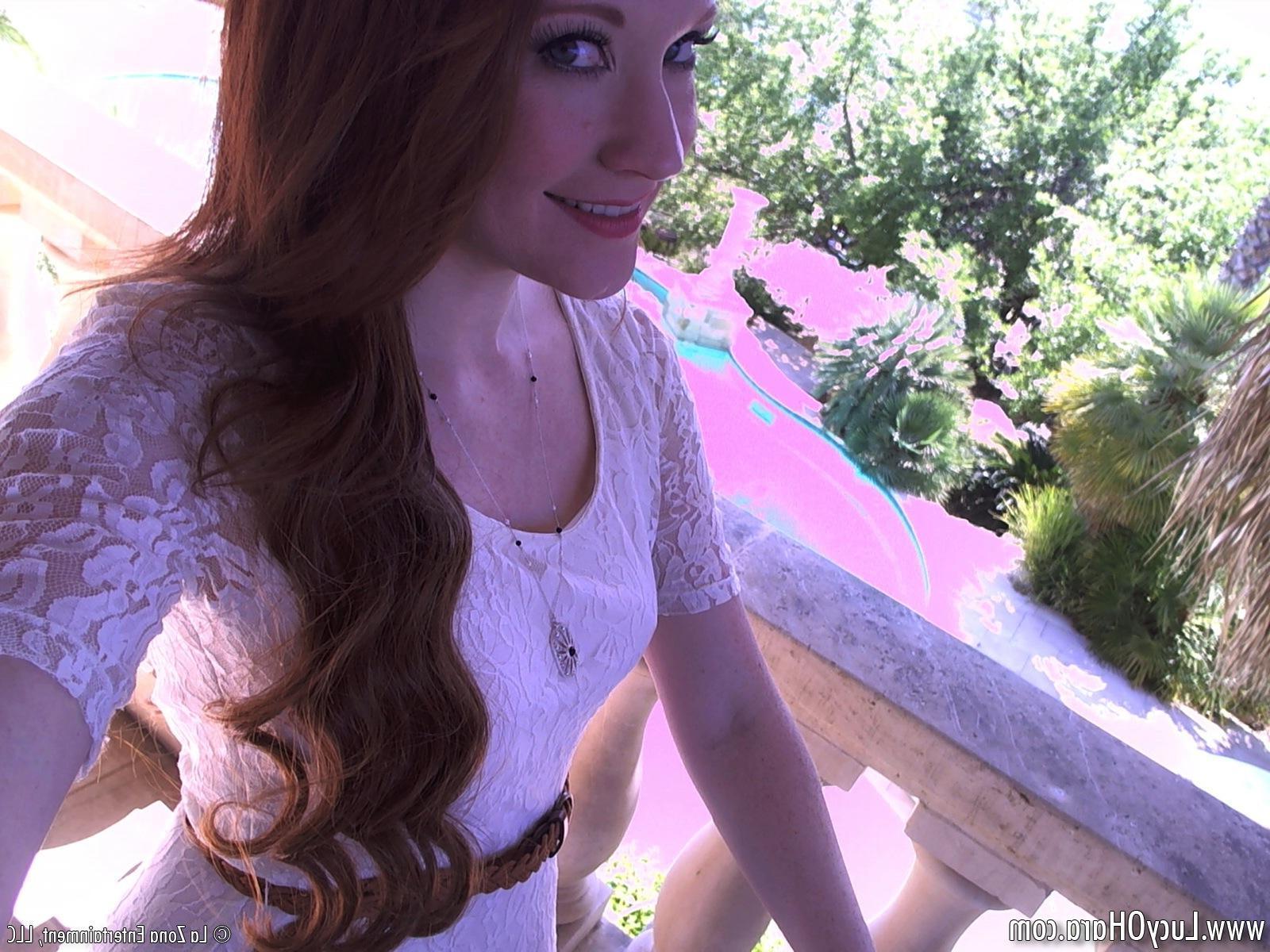 15P Lucy Ohara wears no panties under her dress as she spreads it on a balcony