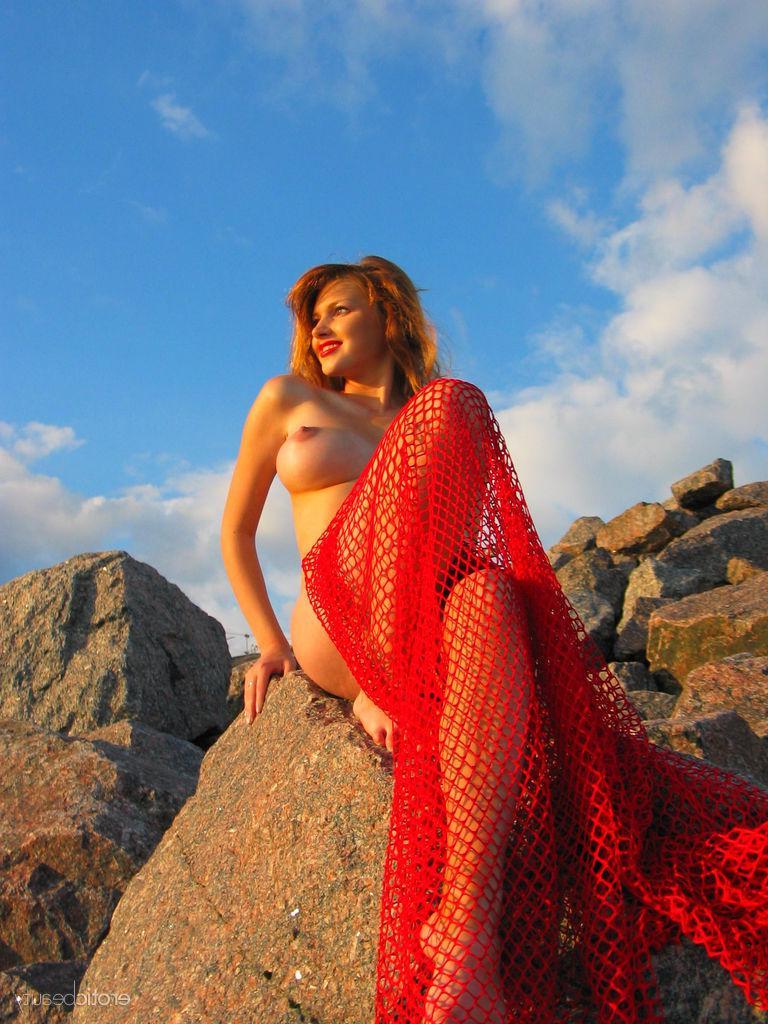 16P Hot redhead Maria D shows off her big boobs outside on a beach