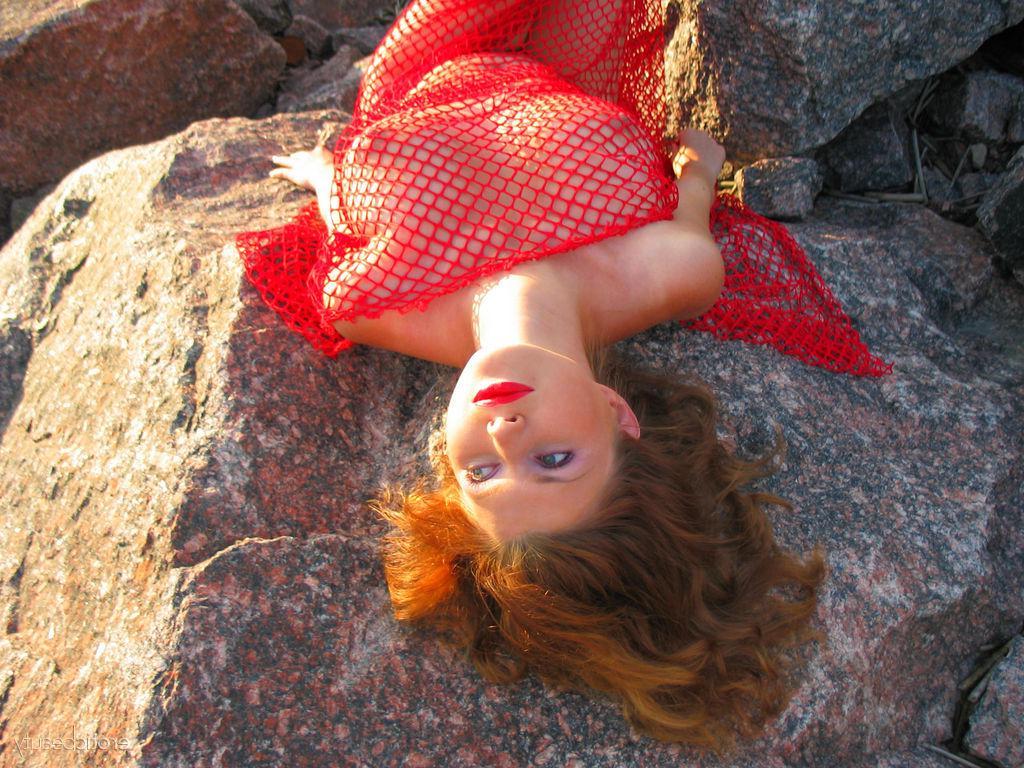 16P Hot redhead Maria D shows off her big boobs outside on a beach