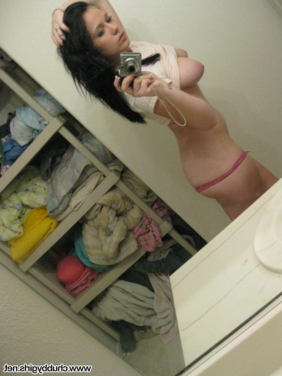 15P Busty girl Mia shows off her big natural boobs in the mirror
