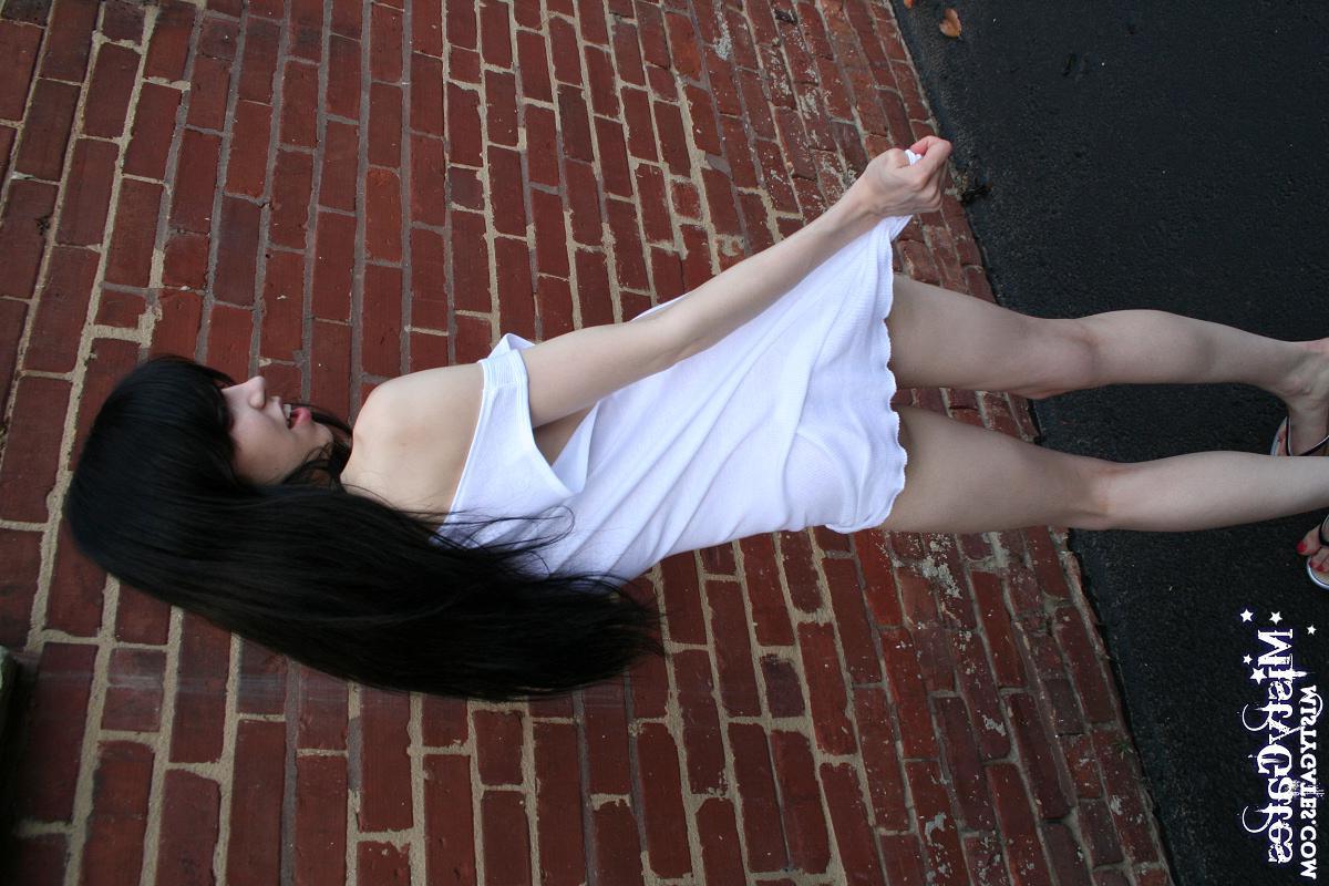 20P Pictures of Misty Gates stripping for you outside