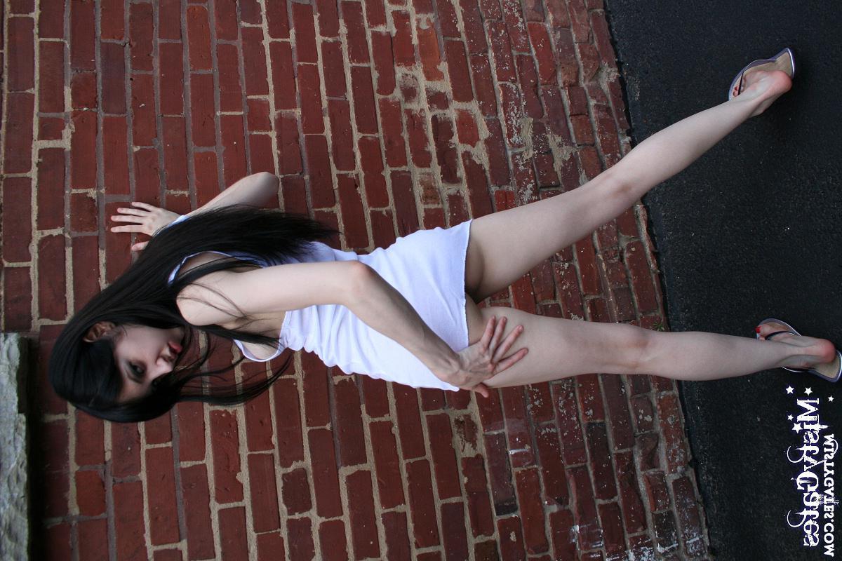 20P Pictures of Misty Gates stripping for you outside