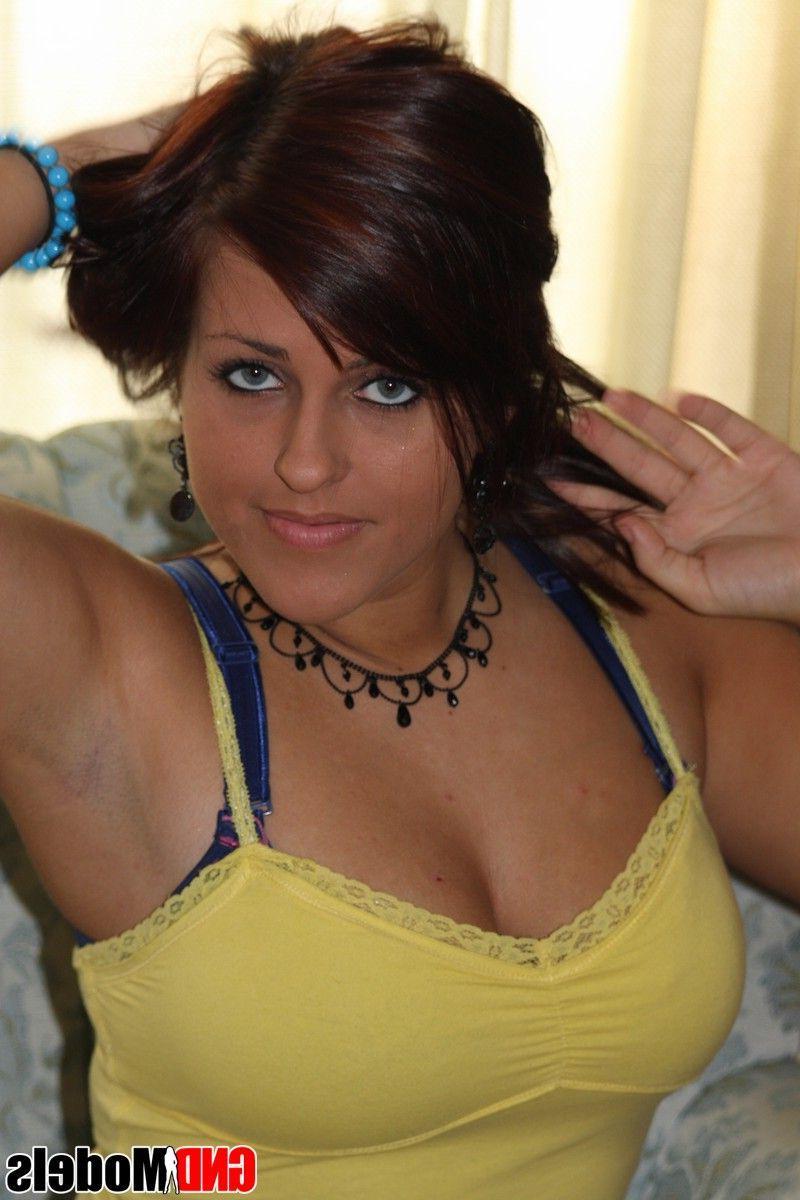 12P Pictures of a brunette girl showing her big boobs