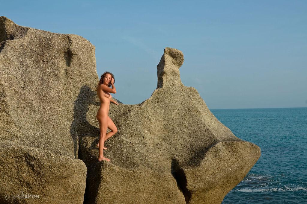 16P Brunette girl Sarka displays her naked body outside by the beach