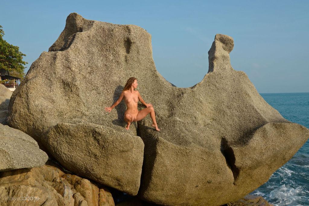 16P Brunette girl Sarka displays her naked body outside by the beach