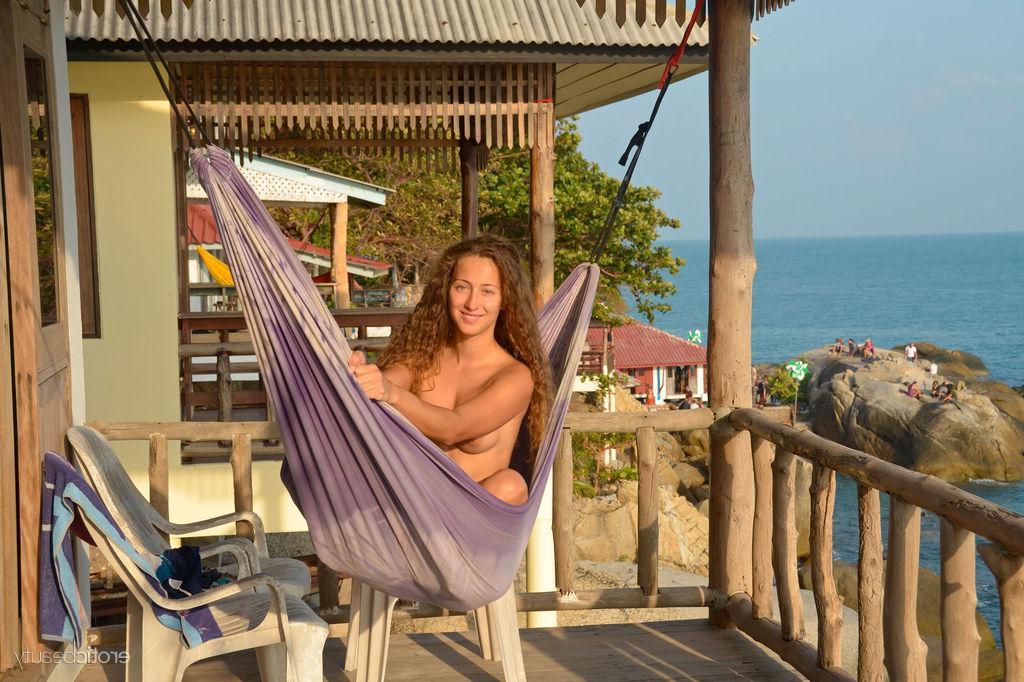 16P Brunette girl Sarka displays her naked body outside by the beach