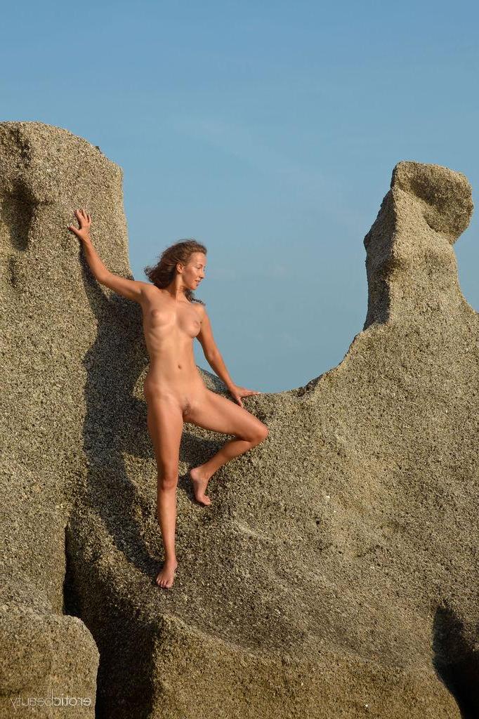 16P Brunette girl Sarka displays her naked body outside by the beach
