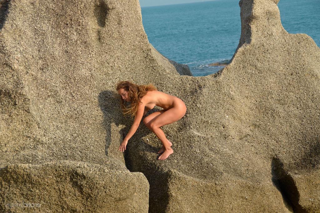 16P Brunette girl Sarka displays her naked body outside by the beach