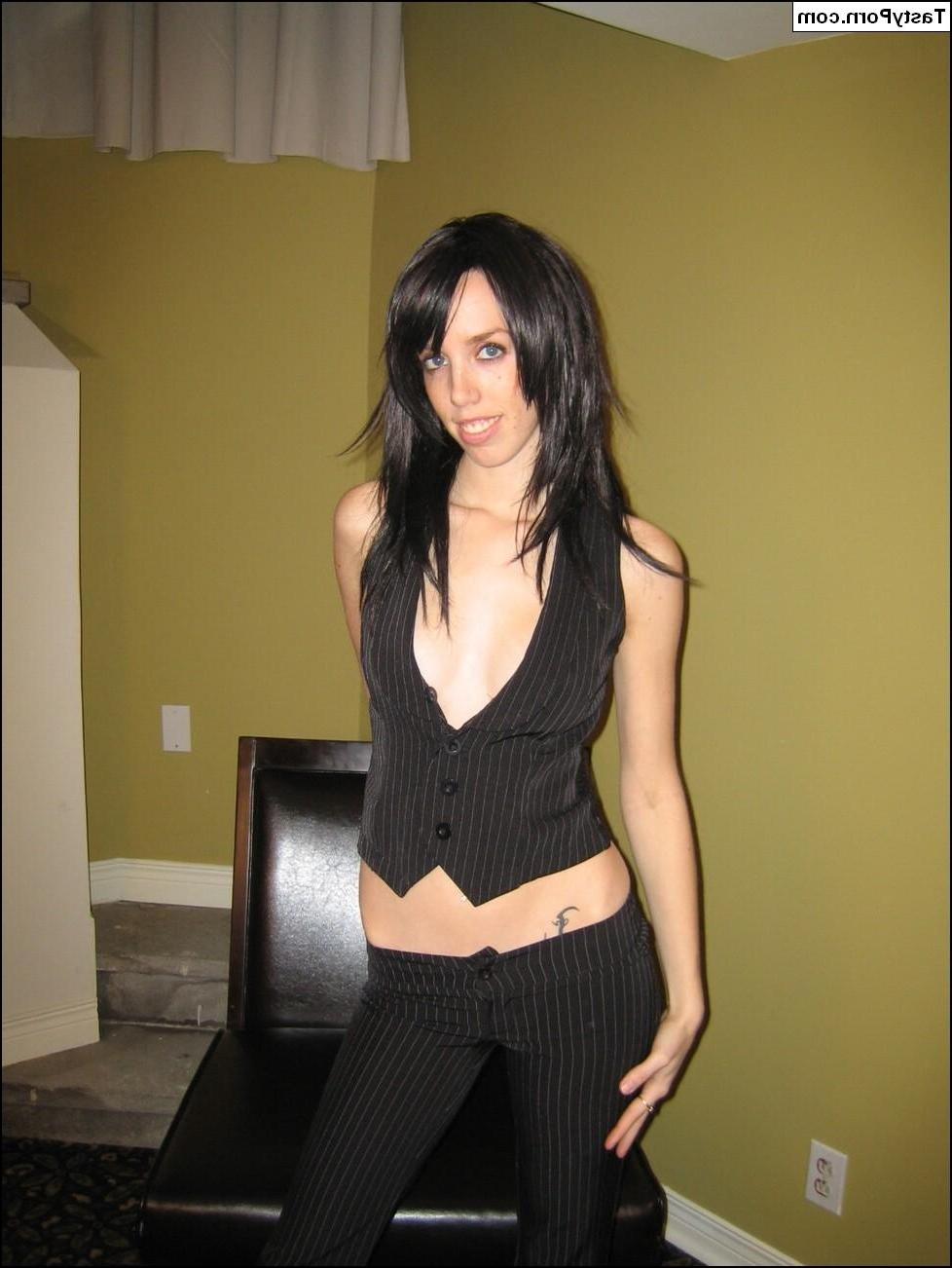 15P Pictures of Tasty Julie stripping naked on a chair