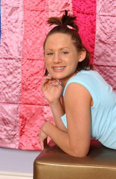 14P Pictures of Teen Emery stretching her pussy with a vibrator