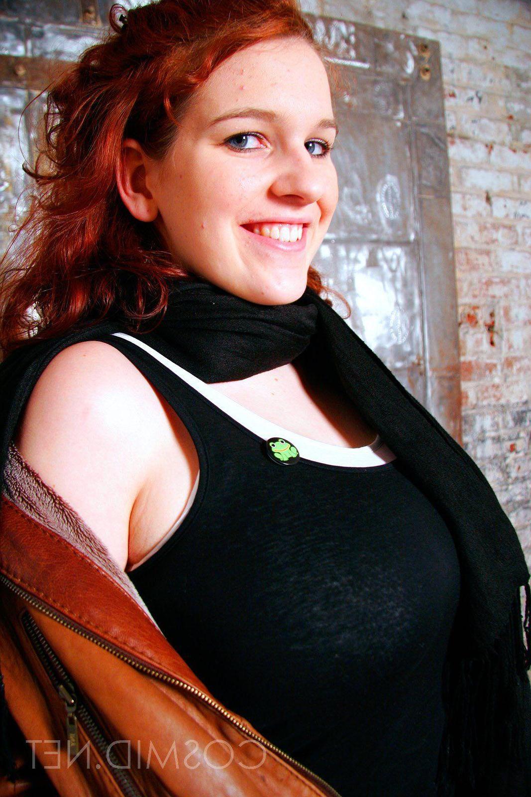 16P Pictures of a redhead girl with big boobs teasing in her socks