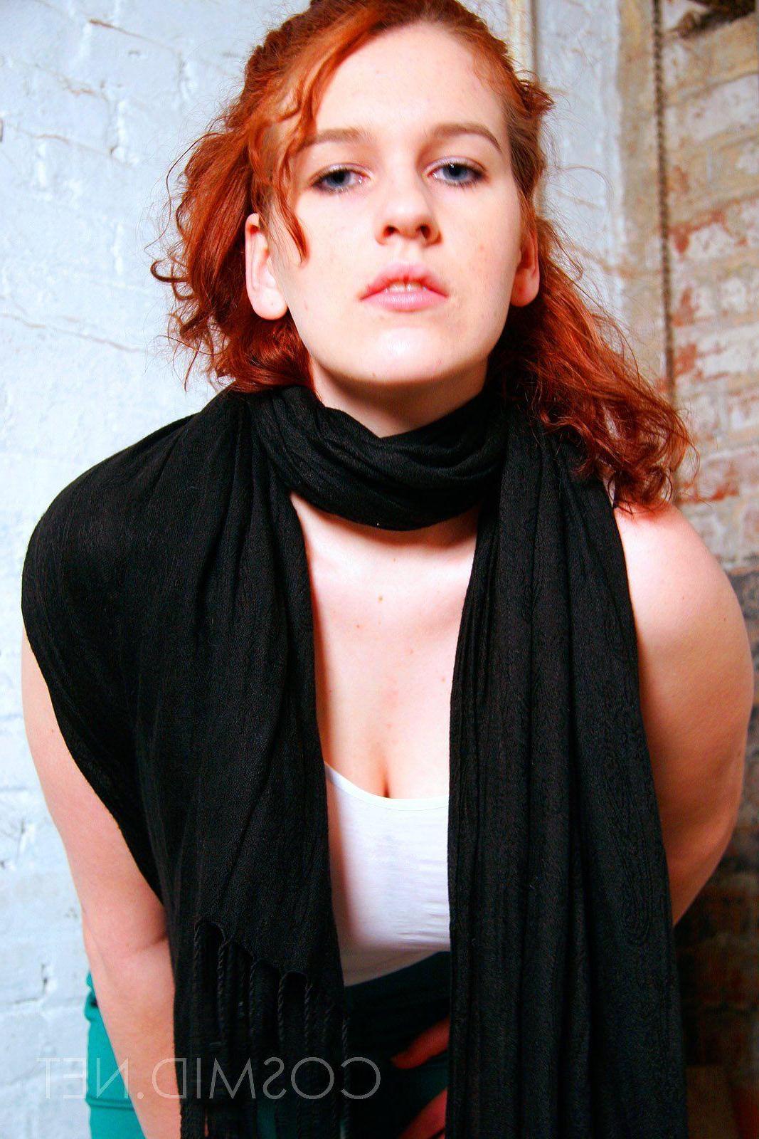 16P Pictures of a redhead girl with big boobs teasing in her socks