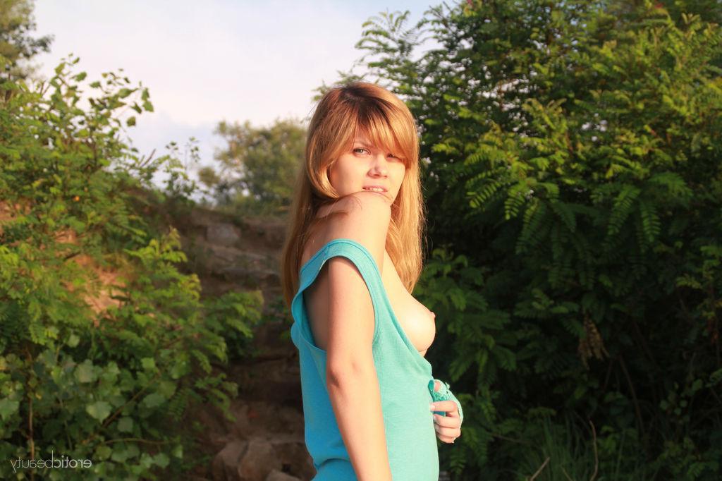 16P Redhead teen Agni A gets naked on the beach in "Warm Sensation"