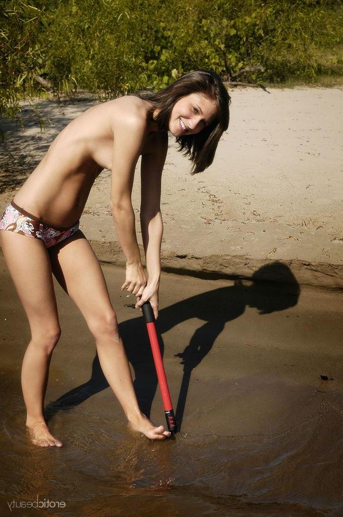16P Brunette girl Elela gets wet on the beach