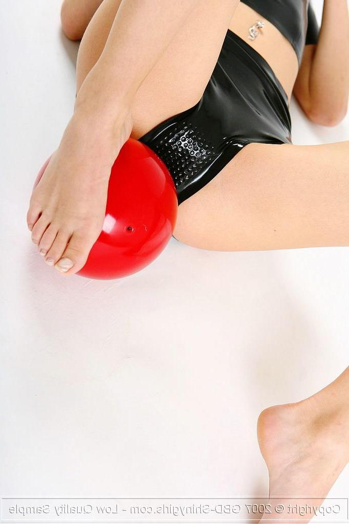 16P Pictures of a hot blonde shinygirl playing with a red ball