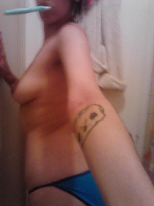 10P Pierced and tattooed chick strips naked while camwhoring