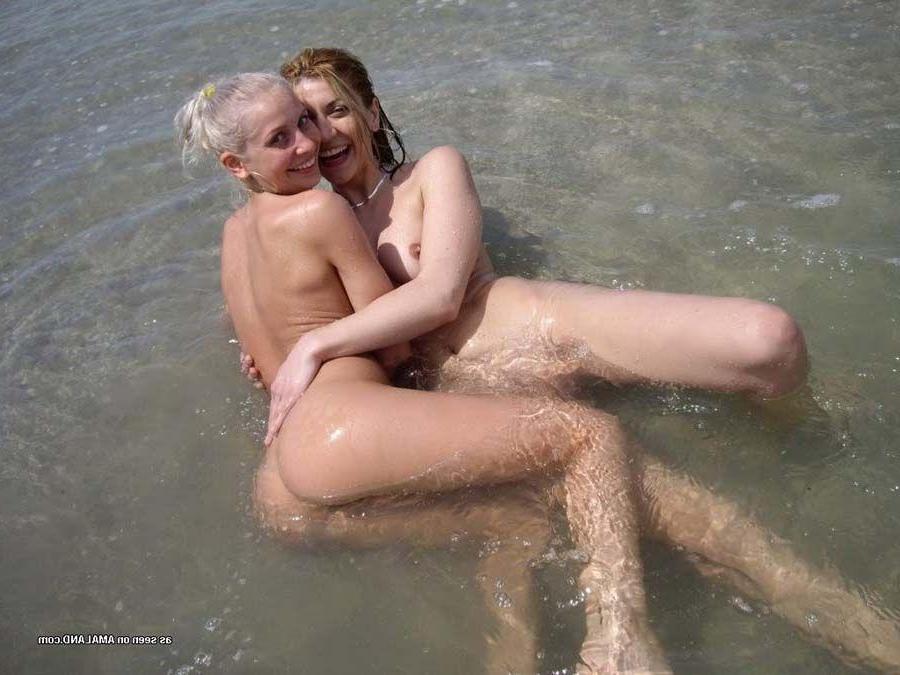 16P Pictures of two hot teens eating pussy on a beach