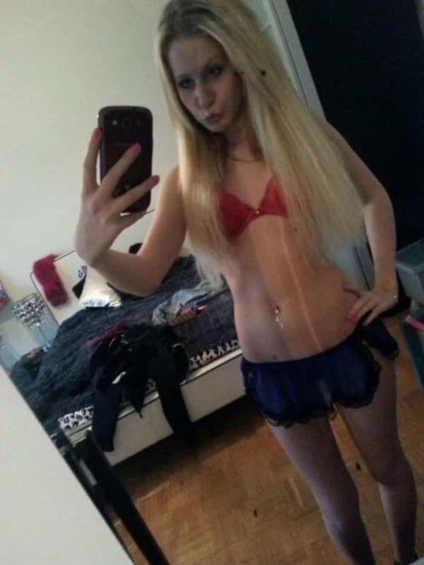14P Hot blonde teen shows her tight figure in lingerie while posing