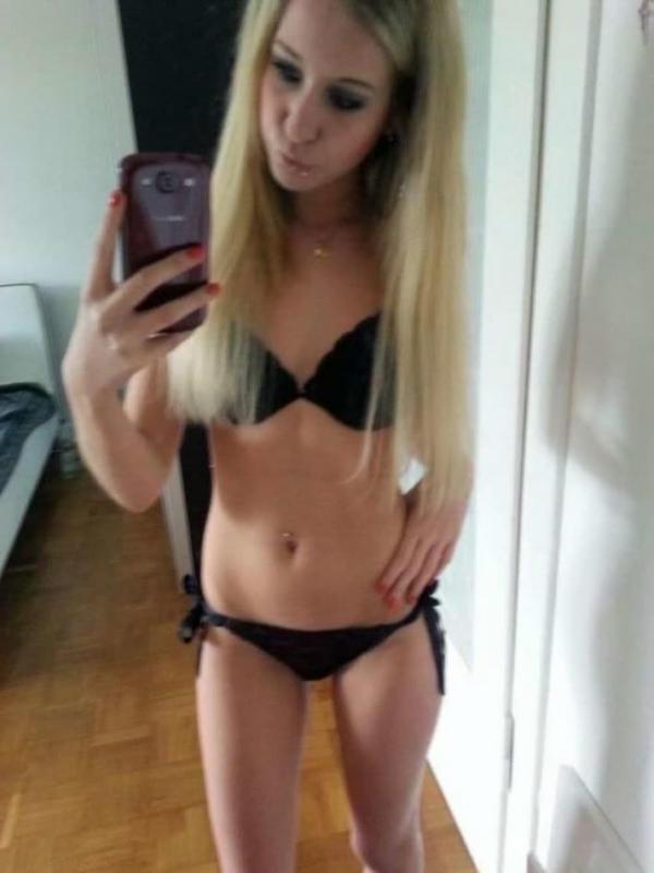 14P Hot blonde teen shows her tight figure in lingerie while posing