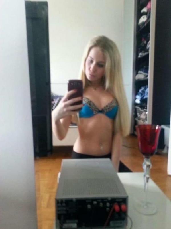 14P Hot blonde teen shows her tight figure in lingerie while posing