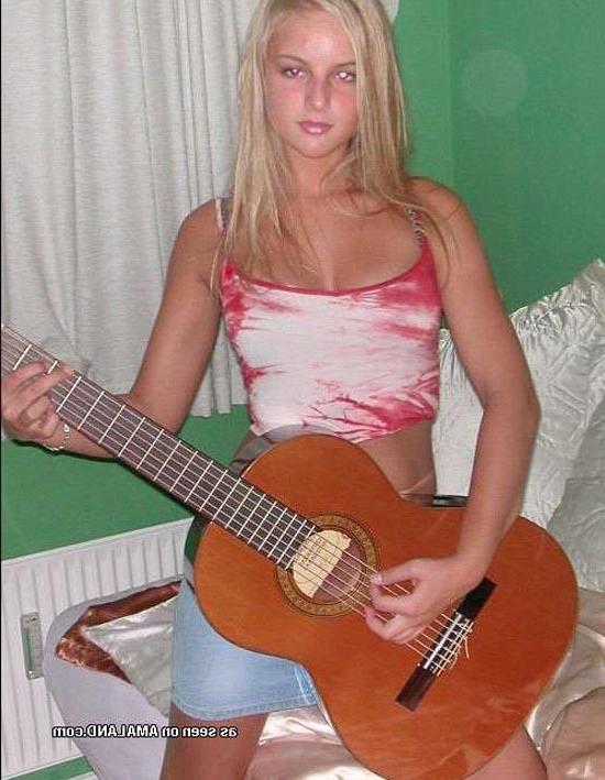15P Blonde rockstar cutie posing with her guitar