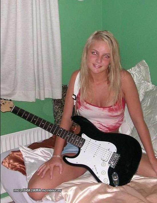 15P Blonde rockstar cutie posing with her guitar