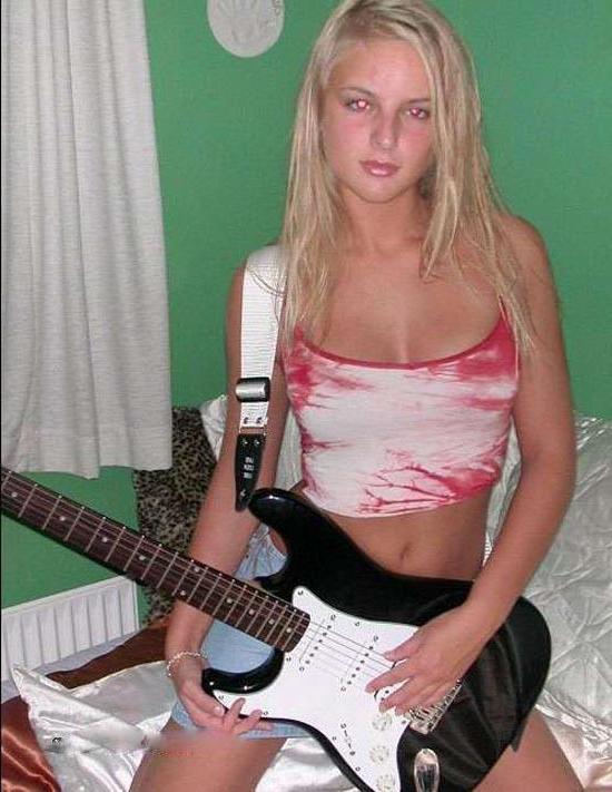 15P Blonde rockstar cutie posing with her guitar