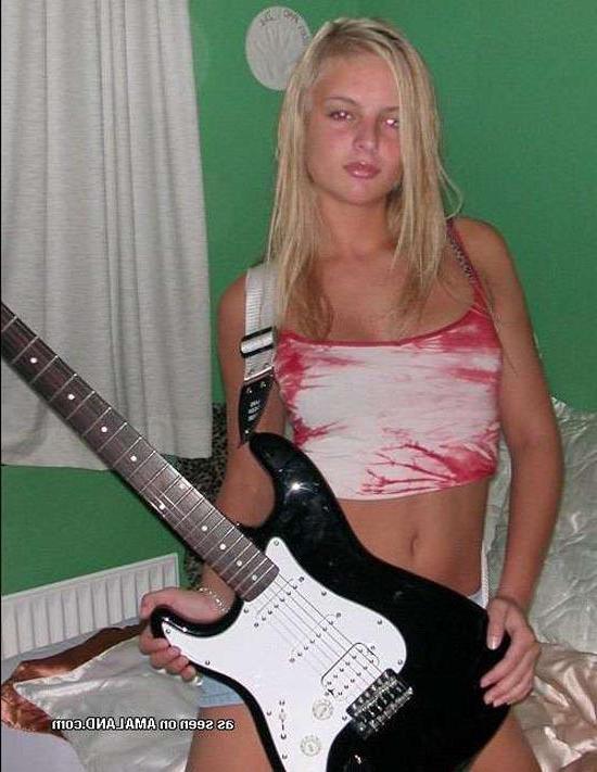 15P Blonde rockstar cutie posing with her guitar