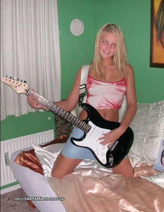 15P Blonde rockstar cutie posing with her guitar