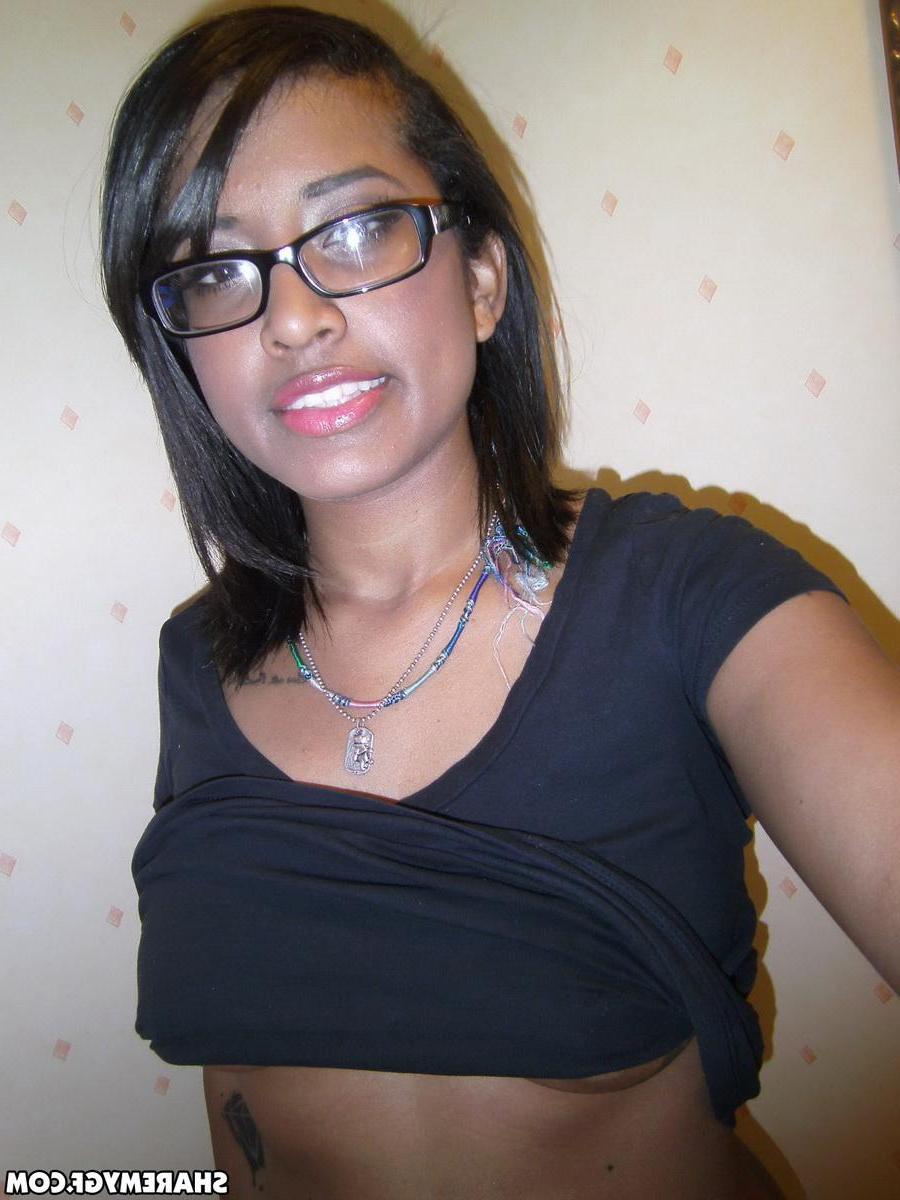 12P Cute black girlfriend teases with her perky tits while taking selfshot pictures