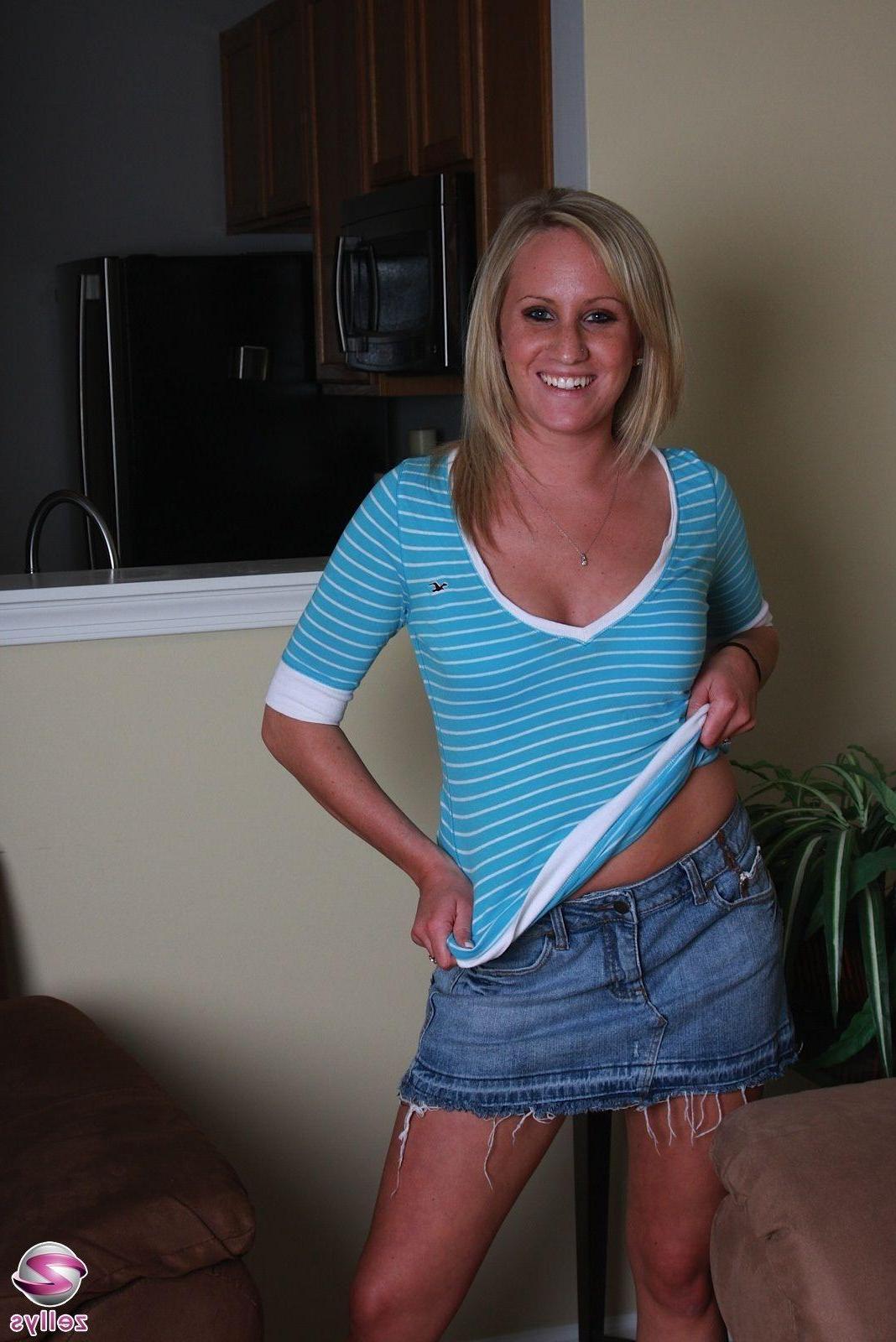 15P Pictures of a blonde girl stripping to her panties