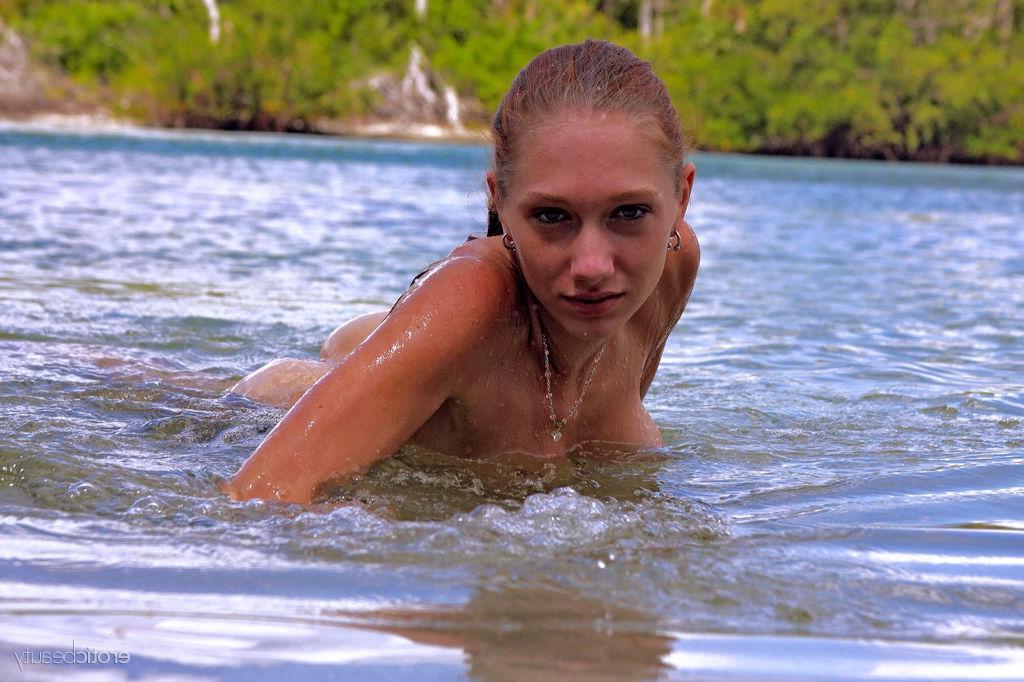 16P Beautiful girl Angeli gets totally nude and hops in the lake