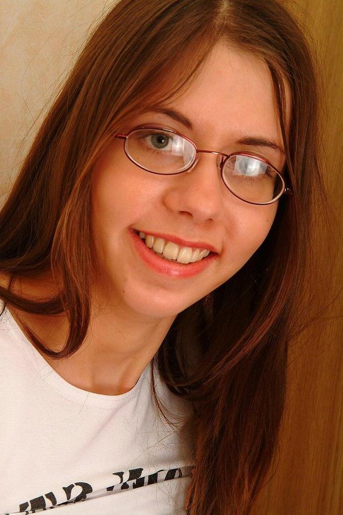 15P Cute girlfriend wearing glasses and posing in her bed