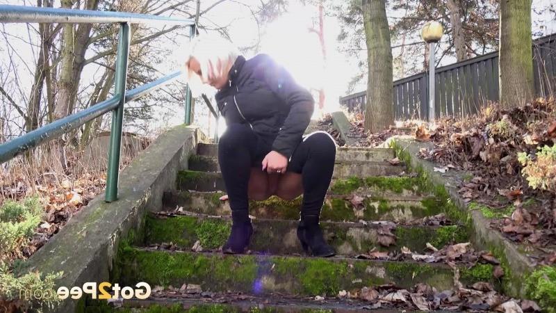 15P Hot blonde has a warm piss outside on steps