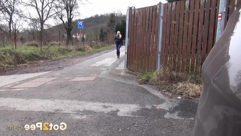 15P Blonde babe pisses onto concrete like a sprinkler