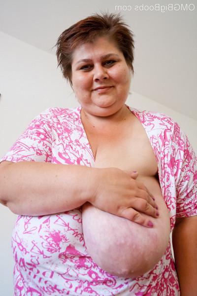 15P Plump mature babe lets her humongous boobs hang out