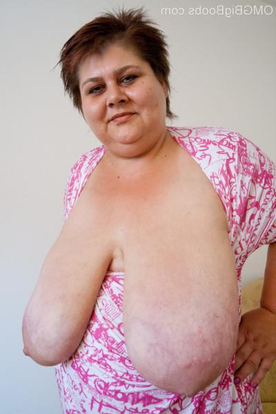 15P Plump mature babe lets her humongous boobs hang out